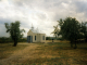 <p>The so-called "Monday" or "Güls" chapel located in the German cemetery in Krasnoe, Ukraine (formerly Krasna, Bessarabia, Russia) and the stone memorial dedicated to the Germans who lived in Krasna from 1814-1940. The chapel was built by Dimitry Bratan of Krasnoe, Ukraine.  <br />
The child is a Ukrainian child who locks the chapel each day.  Taken 22 July 1996.<br />
<br />
Source:  Margaret nee Ternes Cremer</p><p>124a_page-109.jpg</p><p><a href="/_detail/alles/apk-1a/124a_page-109.jpg"><img title="Details" src="/lib/plugins/photogallery/images/details_page.png" width="30" /></a></p>